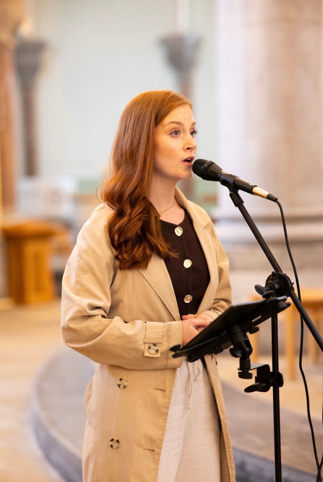 Saoirse singing during a church ceremony